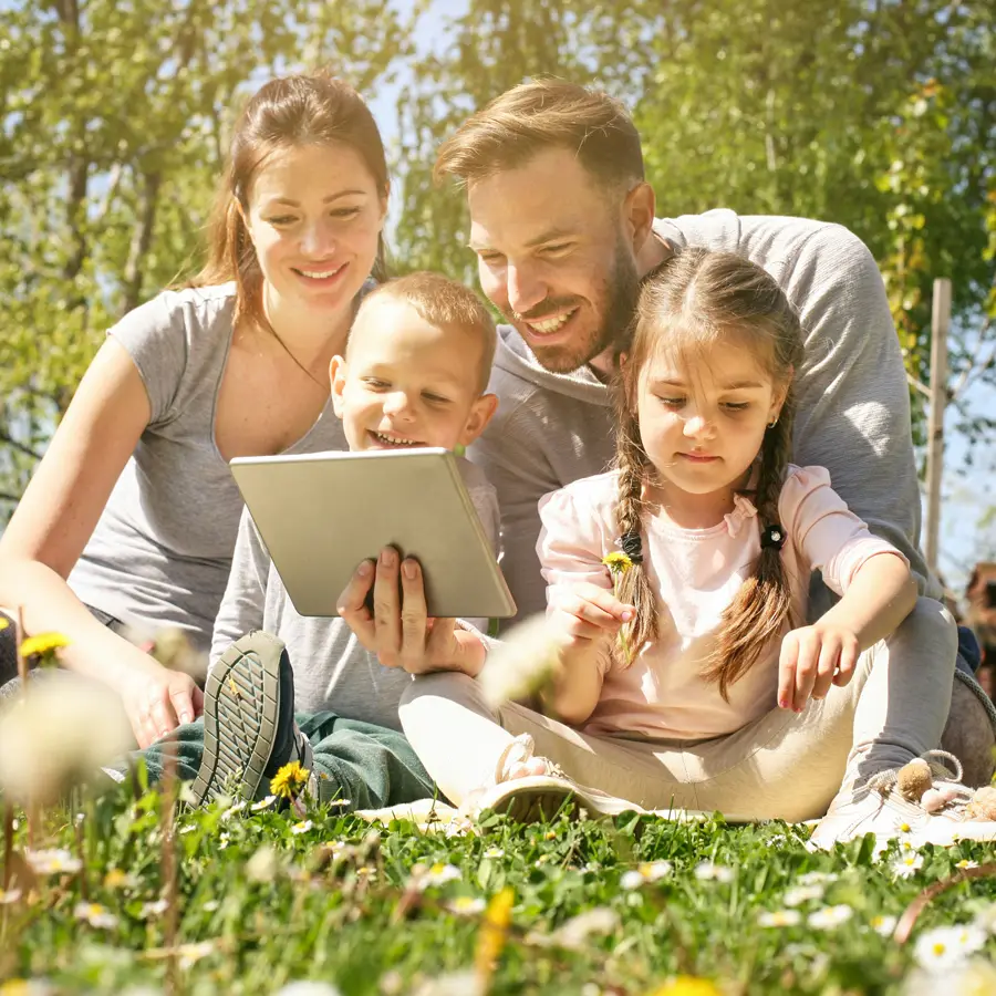 Family sitting in yard